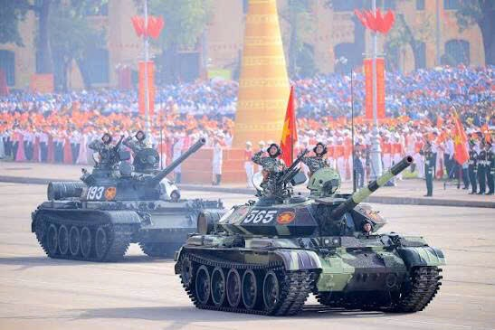 A group of military tanks in a paradeAI-generated content may be incorrect.