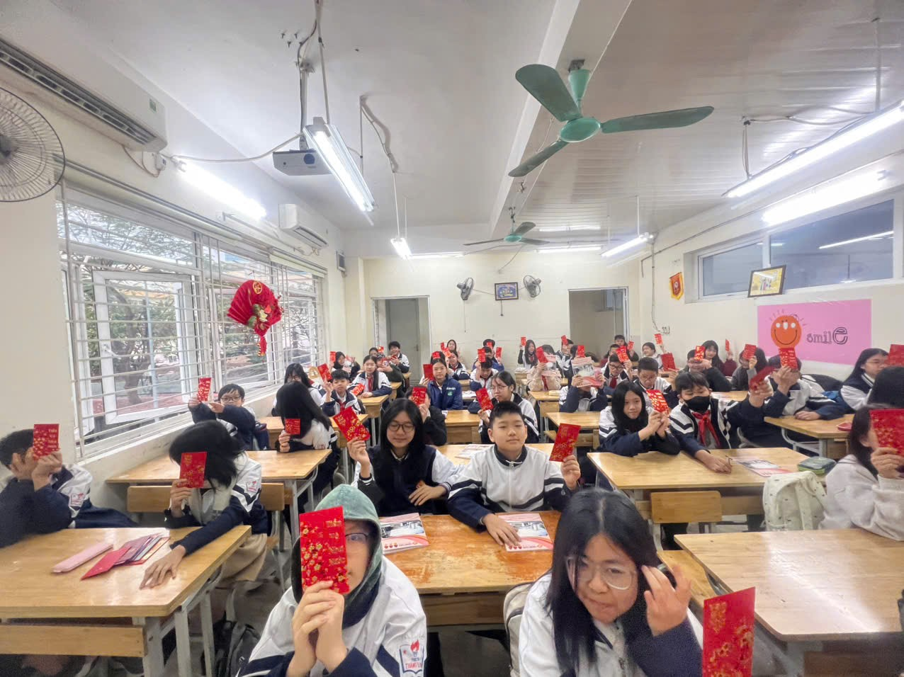 A group of students sitting at desks in a classroomAI-generated content may be incorrect.